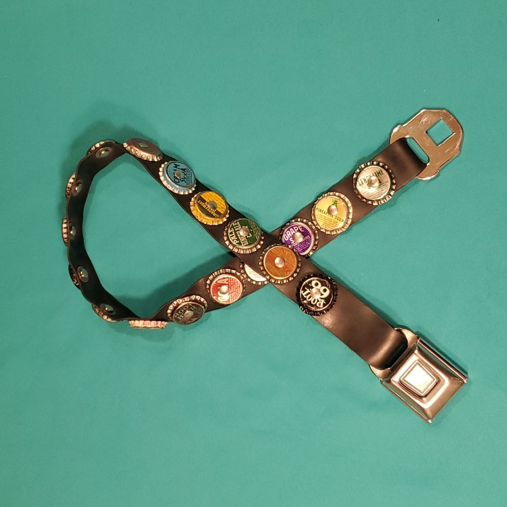 Seat belt bottle cap belt